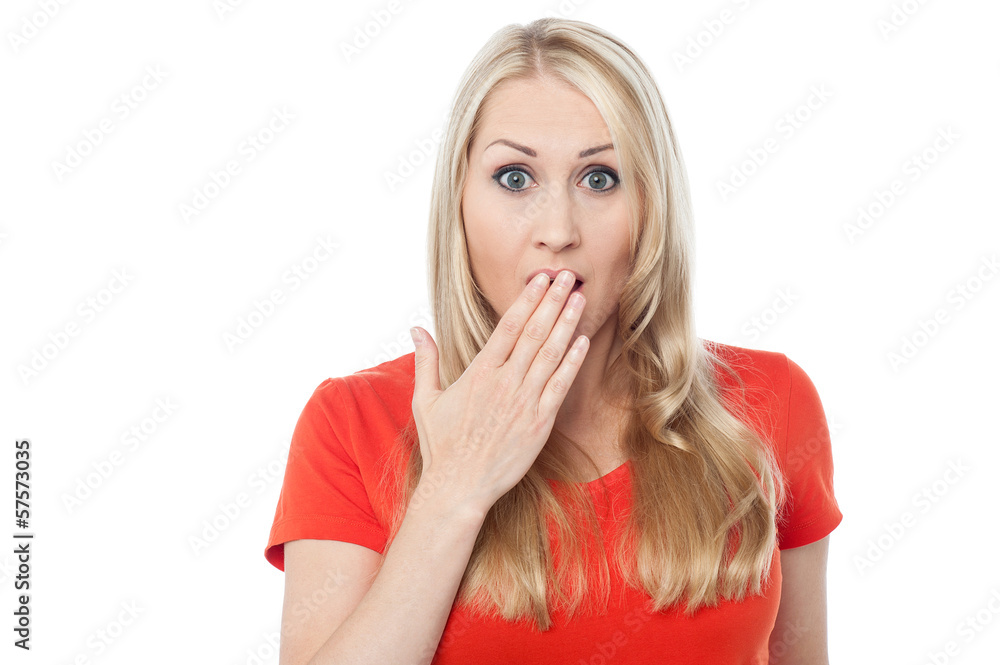 Shocked young woman over white Shocked young woman over white