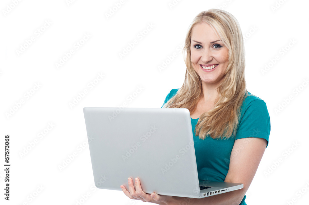 Beautiful young woman working on laptop Beautiful young woman working on laptop