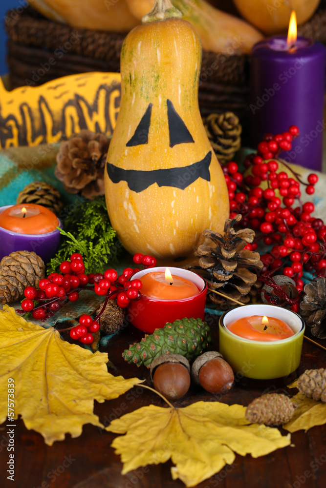 Composition for Halloween with pumpkins and candles close-up Composition for Halloween with pumpkins and candles close-up