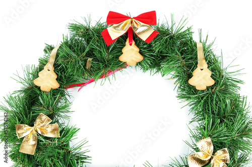 Christmas wreath decorated with cookies isolated on white