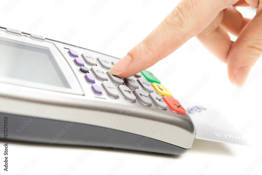 Payment terminal - a finger entering the PIN code Payment terminal - a finger entering the PIN code