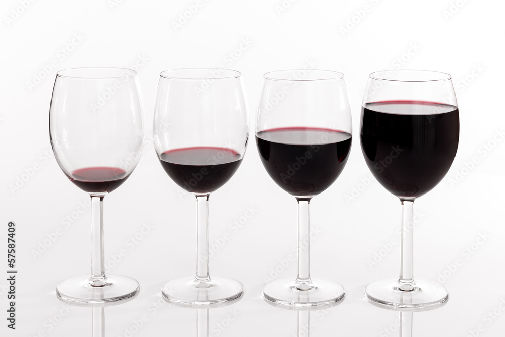 Glasses with different quantities of red wine Glasses with different quantities of red wine