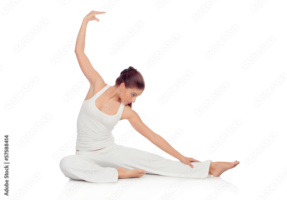 Young woman doing stretching exercises on the floor Young woman doing stretching exercises on the floor
