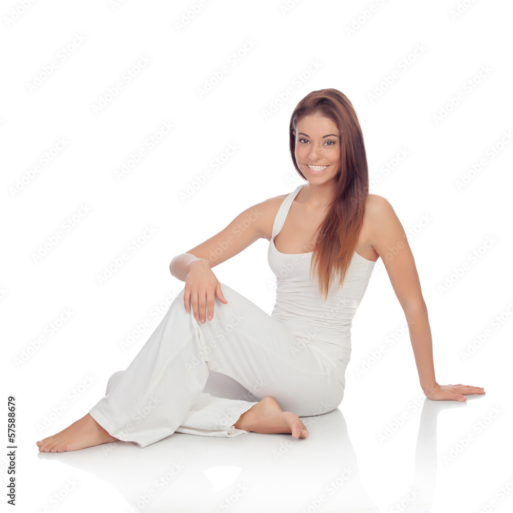 Happy young woman with white comfortable clothing sitting on the Happy young woman with white comfortable clothing sitting on the