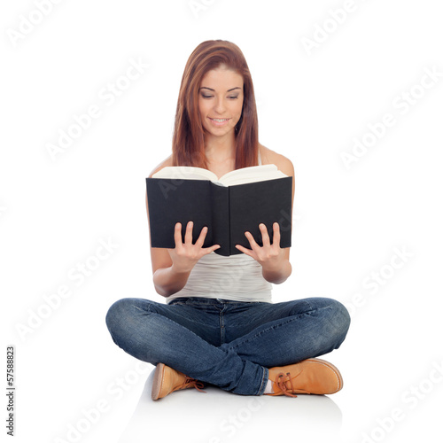 Casual young woman sitting on the floor reading a book © Gelpi