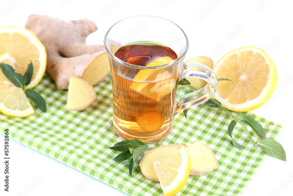 Cup of tea with ginger on napkin isolated on white Cup of tea with ginger on napkin isolated on white