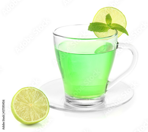 Transparent cup of green tea with mint and lime isolated