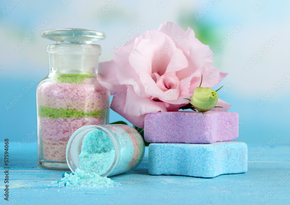 Aromatic salts in glass bottles, on blue background Aromatic salts in glass bottles, on blue background