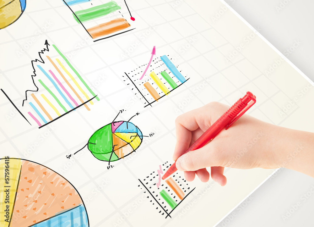 Business person drawing colorful graphs and icons on paper Business person drawing colorful graphs and icons on paper