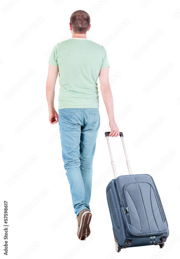 back view of walking man with suitcase. back view of walking man with suitcase.