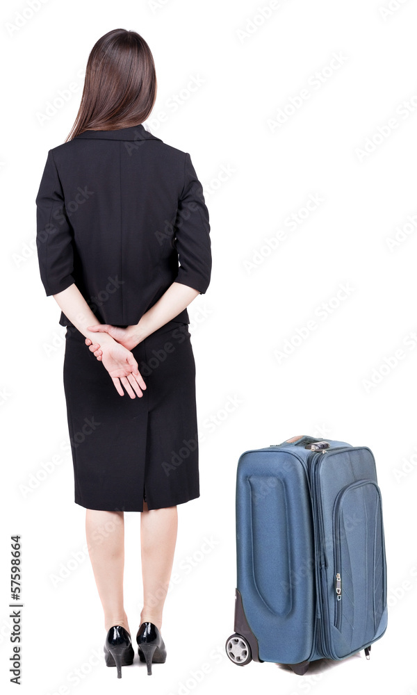 back view of thoughtful business woman traveling with suitcas. back view of thoughtful business woman traveling with suitcas.