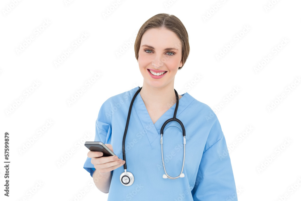 Young woman doctor holding her smartphone Young woman doctor holding her smartphone