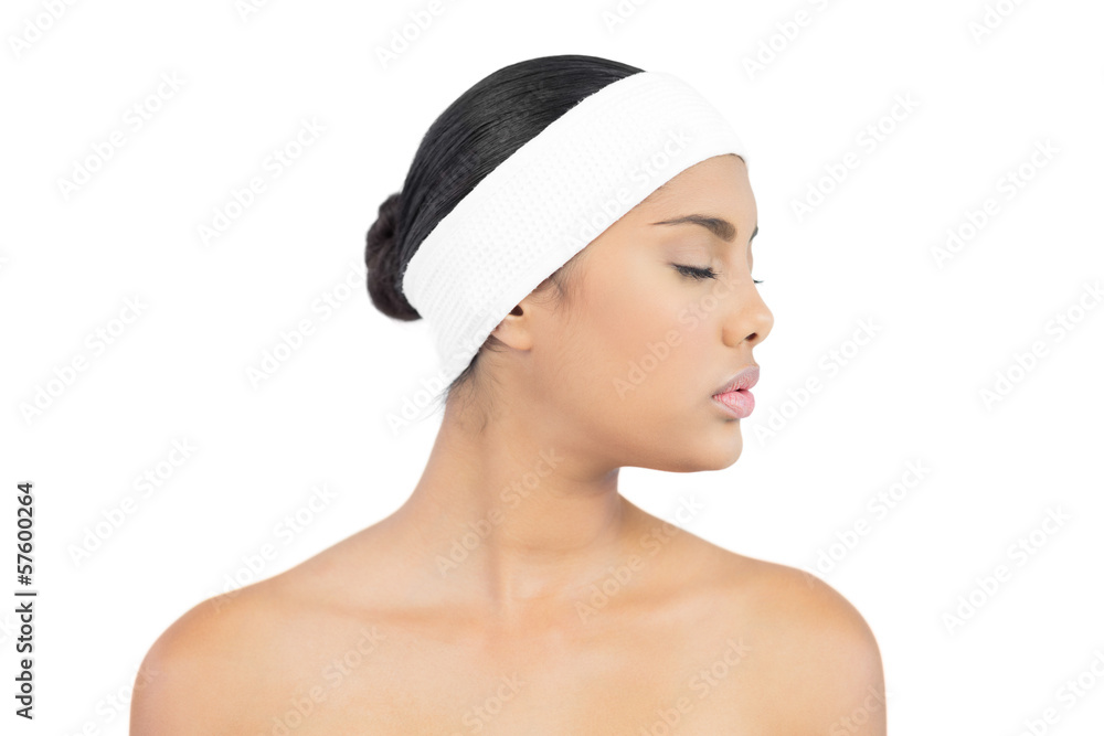Calm nude brunette with hairband closing her eyes Calm nude brunette with hairband closing her eyes