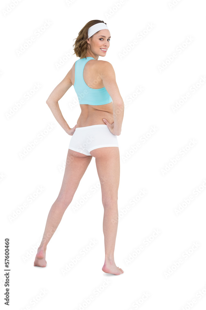 Pretty slender woman looking over her shoulder at camera wearing Pretty slender woman looking over her shoulder at camera wearing