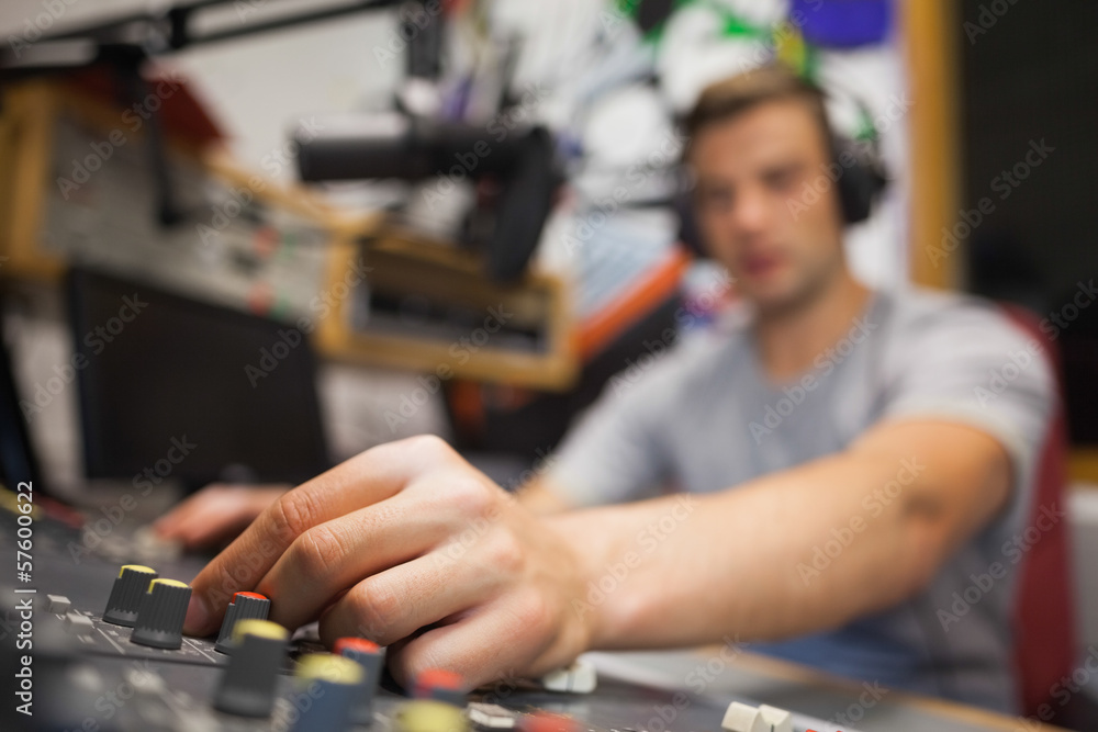 Handsome radio host moderating touching switch Handsome radio host moderating touching switch