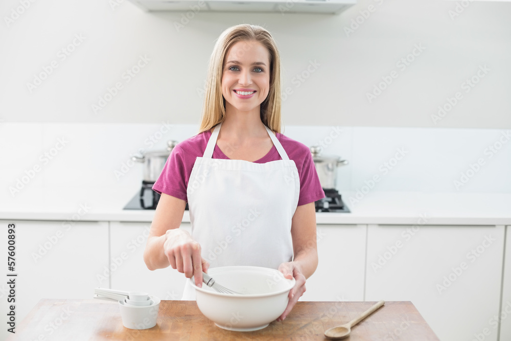 Casual cheerful blonde holding whisk Casual cheerful blonde holding whisk