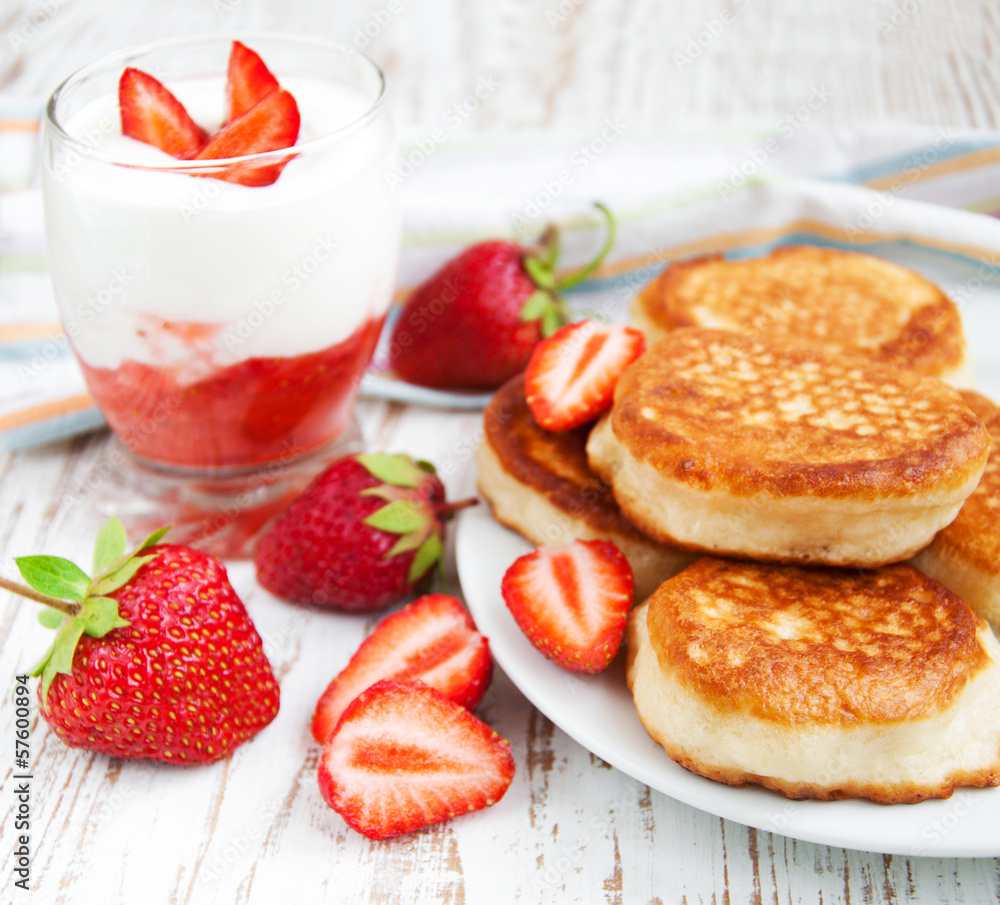 fresh strawberries  pancakes and yogurt