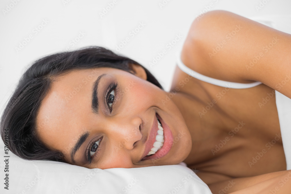 Gorgeous calm woman lying under the cover on her bed Gorgeous calm woman lying under the cover on her bed