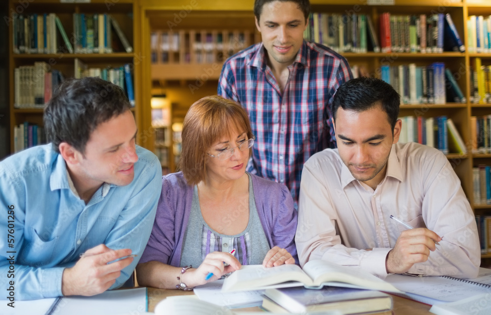 Adult students studying together in the library Adult students studying together in the library