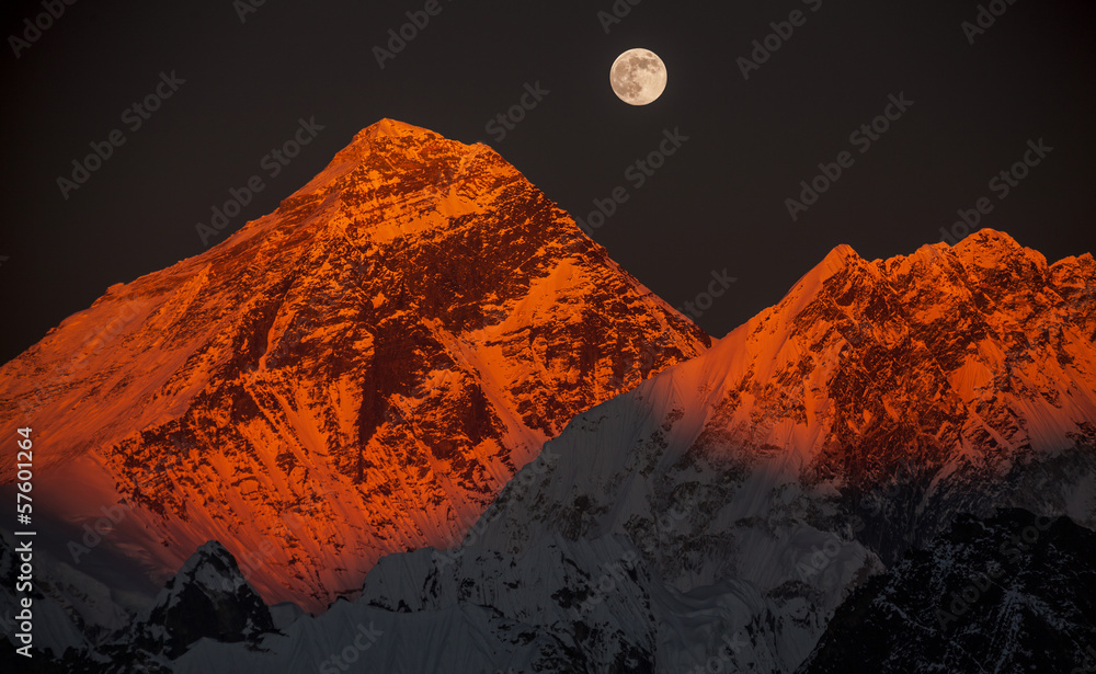 Peak Everest at sunset in a full moon.