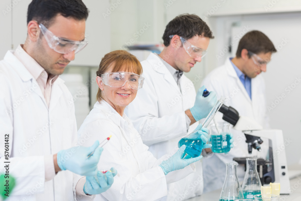 Group of scientists working at the laboratory Group of scientists working at the laboratory