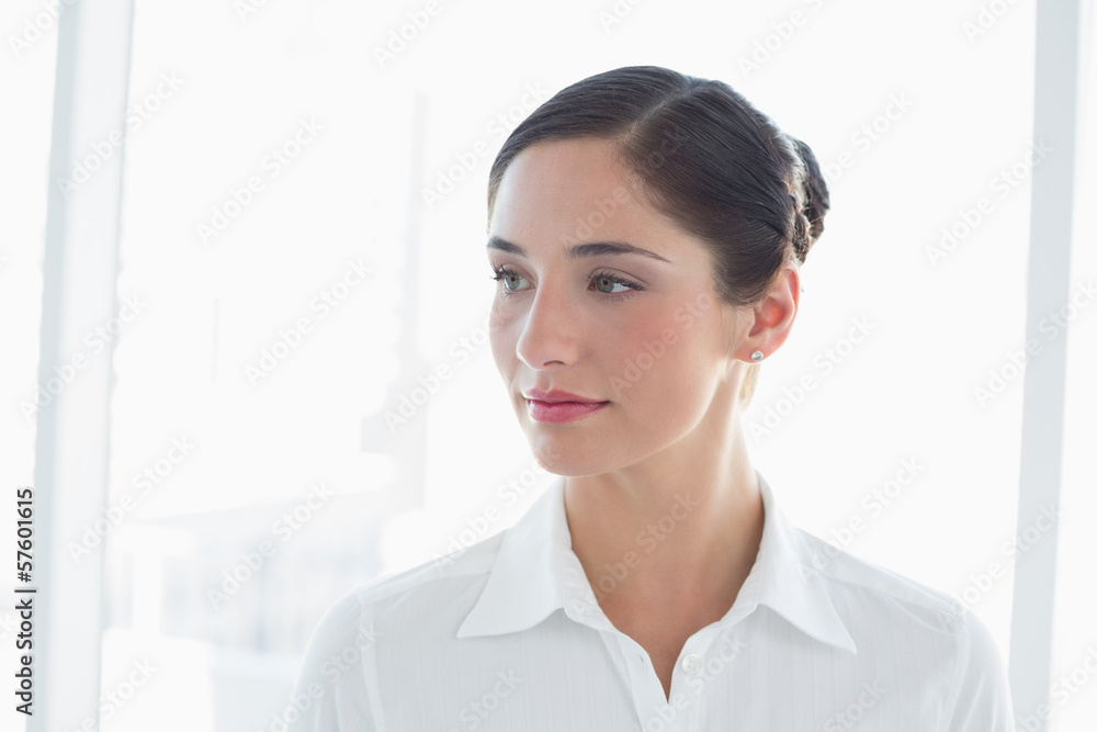 Thoughtful young business woman looking away Thoughtful young business woman looking away