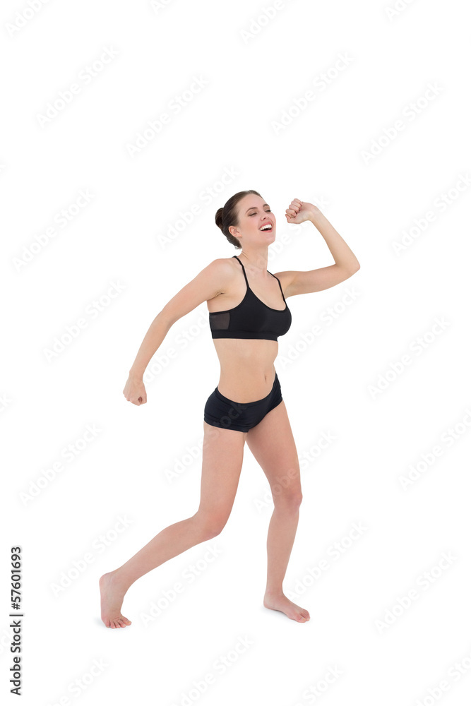 Sporty young woman dancing isolated on white background Sporty young woman dancing isolated on white background