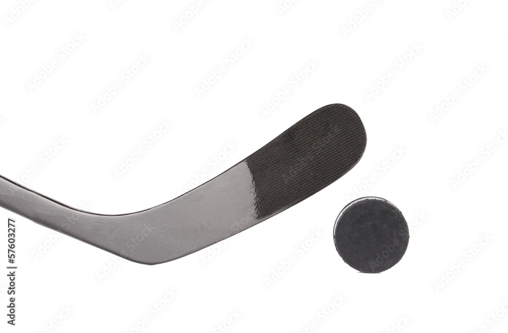 Black ice hockey stick and puck. Black ice hockey stick and puck.
