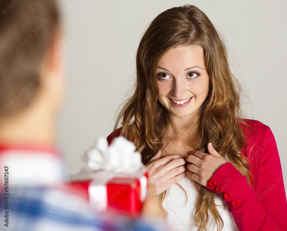 Man handing woman gift Man handing woman gift