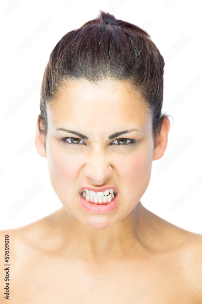 Front view of upset young woman gazing at camera Front view of upset young woman gazing at camera