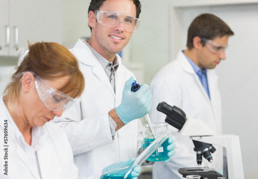 Group of scientists working at the laboratory Group of scientists working at the laboratory