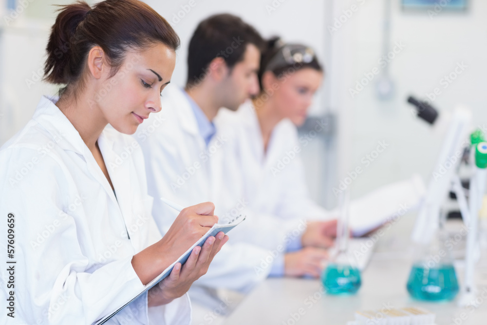 Researchers working on experiments in the laboratory Researchers working on experiments in the laboratory