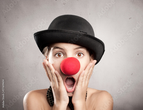surprised little girl with a red nose