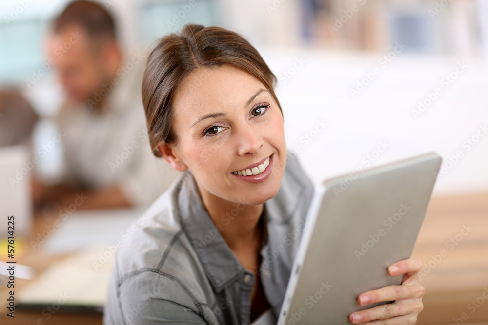 Young woman using tablet in business training