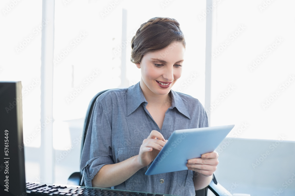 Content businesswoman working with her tablet Content businesswoman working with her tablet
