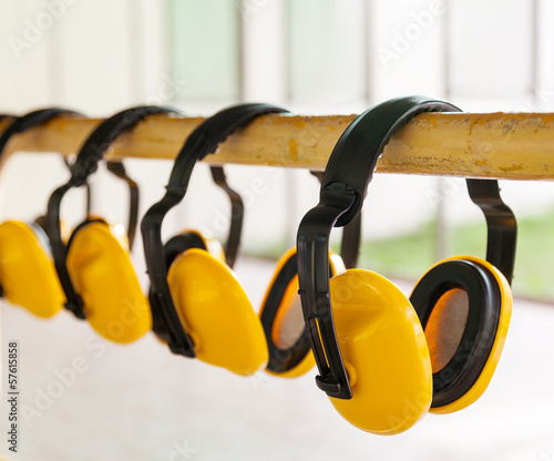 The yellow protective earmuffs for shooting . photo