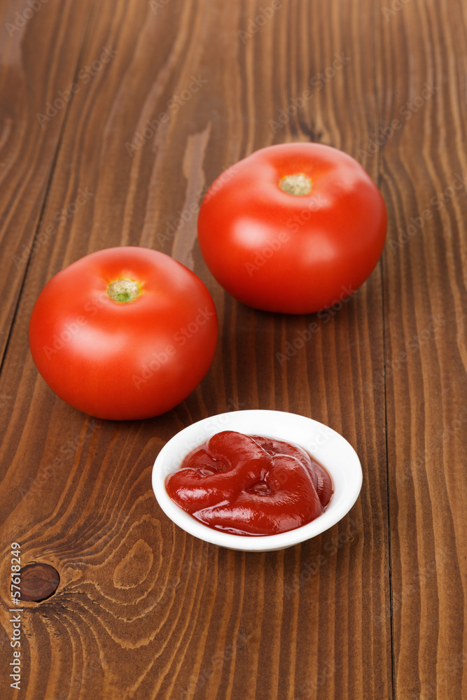 tomato sauce in bowl on wooden table tomato sauce in bowl on wooden table