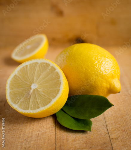Fresh lemons on wooden table