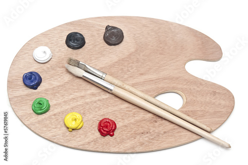 Photo of a wooden artists palette loaded with various colour pai