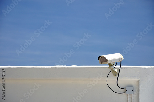Security CCTV camera on the wall. © badztua