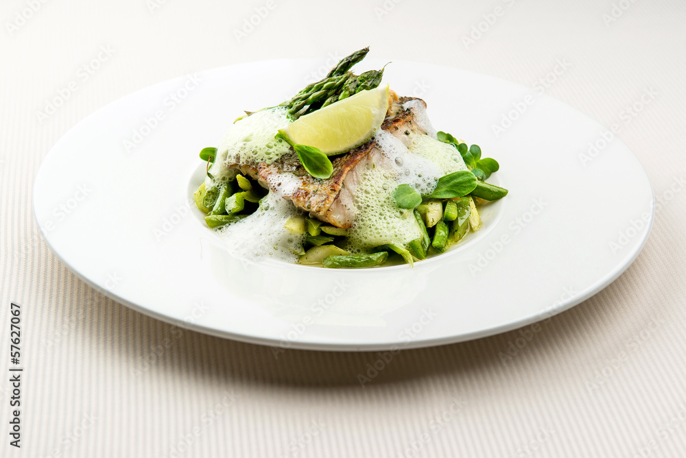 Sea bass fillet with asparagus infused with sauce foam Sea bass fillet with asparagus infused with sauce foam