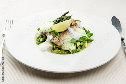Sea bass fillet with asparagus infused with sauce foam