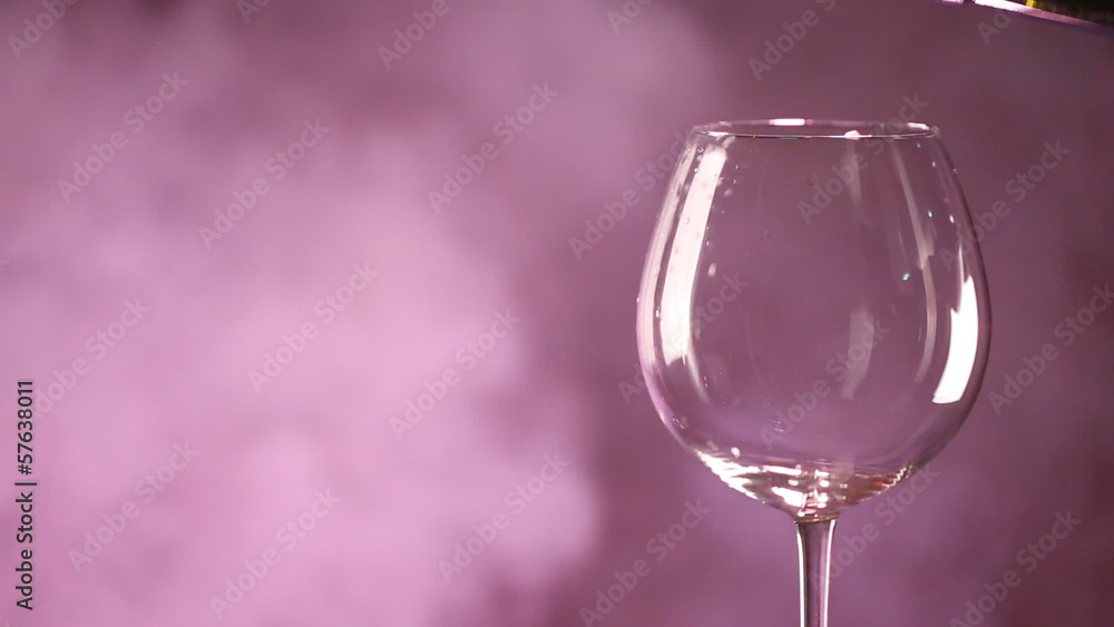 Pouring red wine into a glass Pouring red wine into a glass