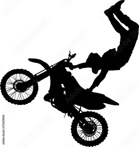 Silhouette of motorcycle rider performing trick
