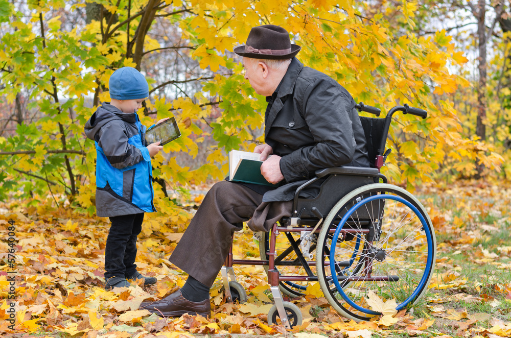 Young boy with his disabled grandfather Young boy with his disabled grandfather