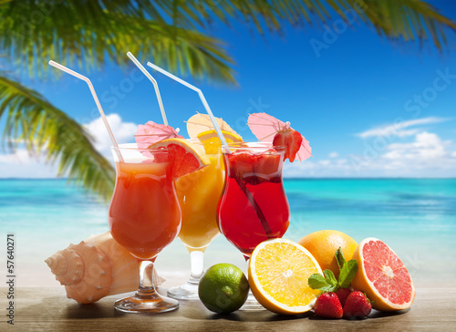 cocktaisl and tropical fruit on the beach