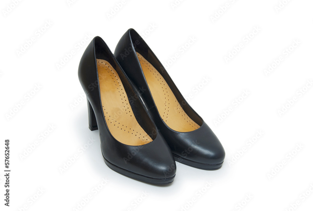 Close-up of female high-heeled shoes over white background Close-up of female high-heeled shoes over white background