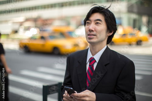 Asian businessman in New York City street © blvdone
