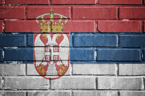 Serbia flag on a textured brick wall
