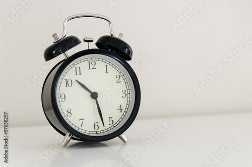 alarm clock watch on vintage background